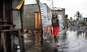 A child stands in rising water after Cyclone Eloise hit Beira, Mozambique. 