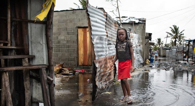 A child stands in rising water after Cyclone Eloise hit Beira, Mozambique. 