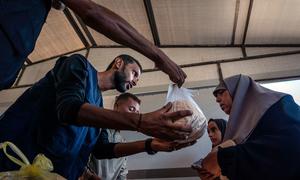 Bread is distributed at a bakery in Nuseirat, Gaza.