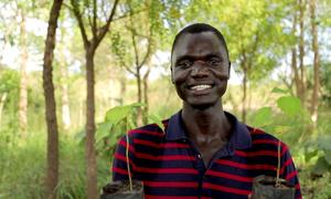 South Sudanese refugee and climate activist Opira Bosco Okot teaches school students in Uganda.