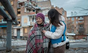 Olena stands in front of her damaged home in Kharkiv, hit during a May 2024 attack (file)