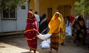 Emergency assistance is distributed to people in Port Sudan who fled conflict in other parts of Sudan.