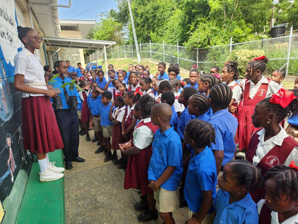 Anthurium Lewis (left) addresses pupils at a school in Tobago.