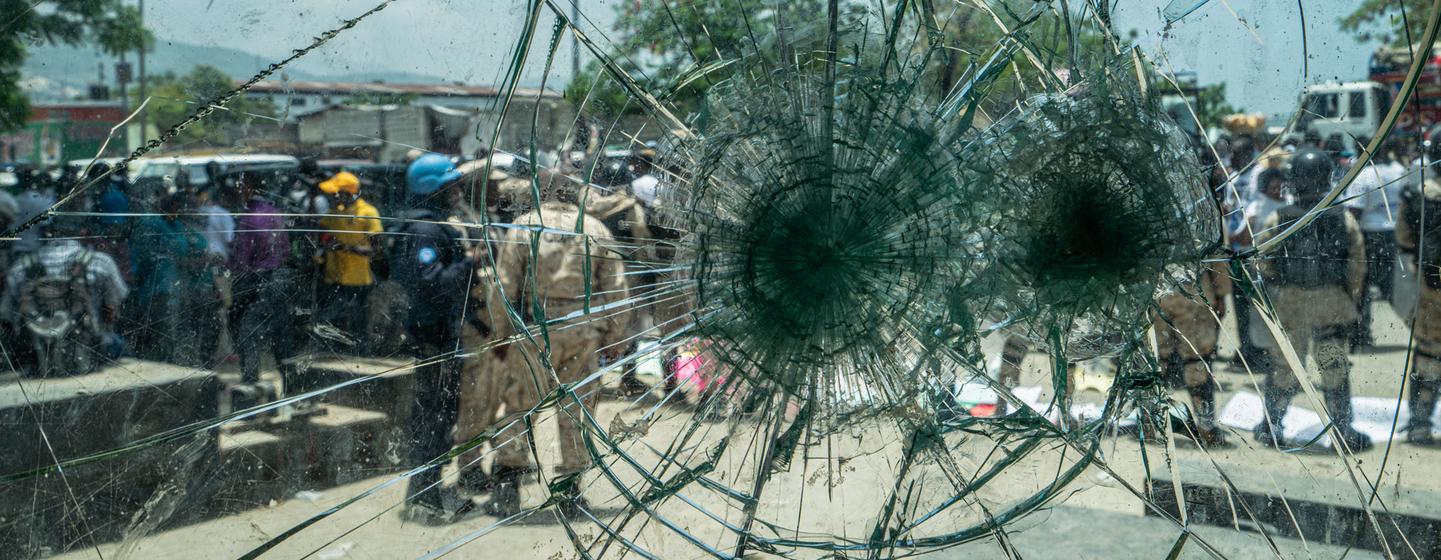 A protest is viewed from a police vehicle in downtown Port-au-Prince, Haiti.