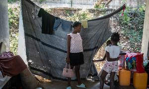 A family displaced by violence lives in a partially constructed school in Port-au-Prince, Haiti.