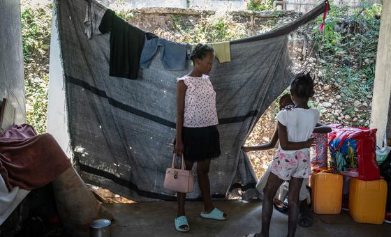 A family displaced by violence lives in a partially constructed school in Port-au-Prince, Haiti.