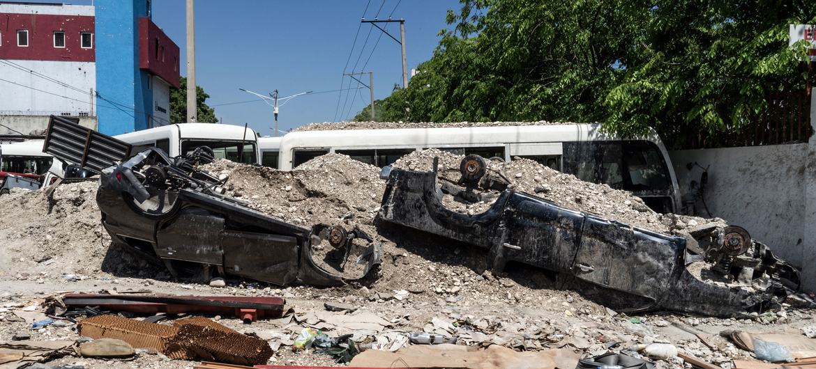 Vehicles act as barricades on a street in Port-au-Prince, Haiti.