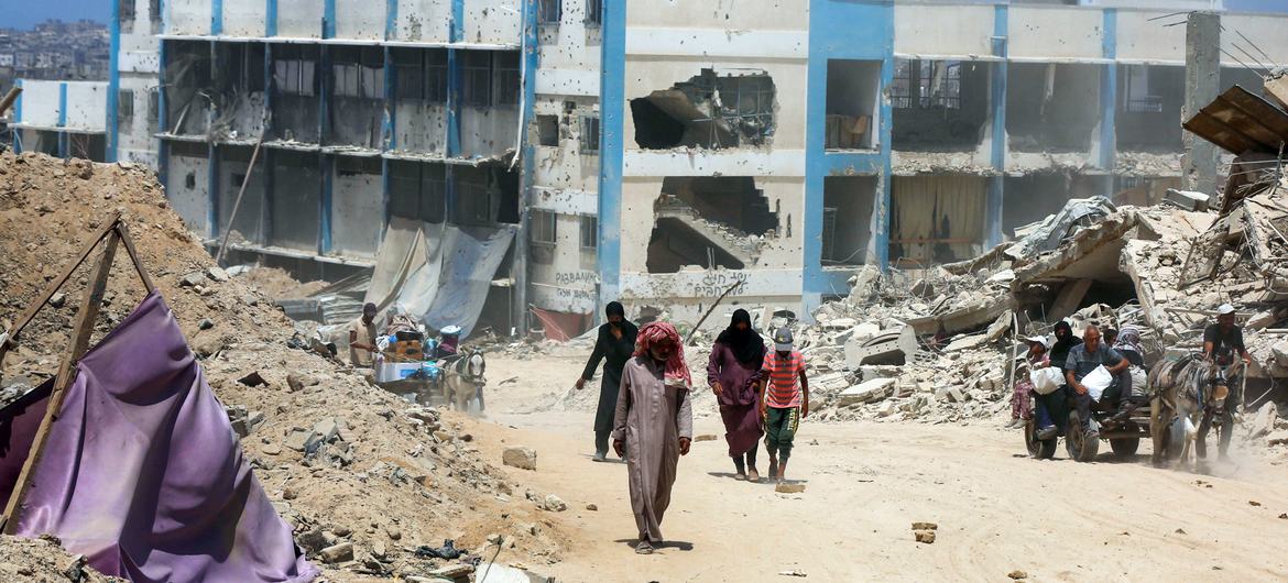 A school which had sheltered displaced people in Gaza stands in ruins.