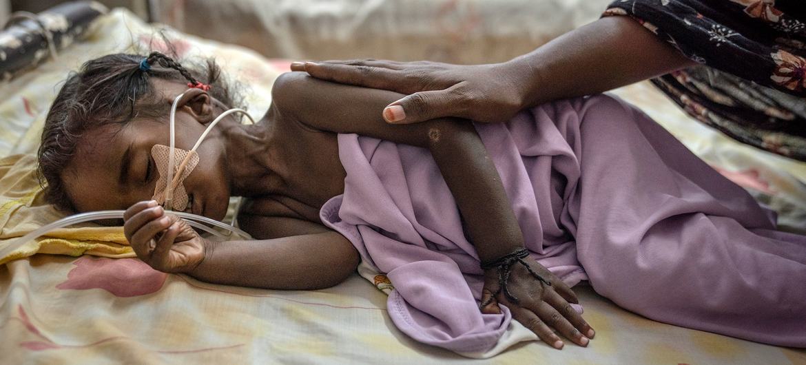 A young girl is treated in a hospital in Khartoum.