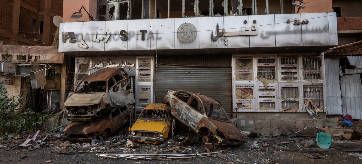 Burnt-out cars in Khartoum demonstrate how the conflict has affected life in Sudan.