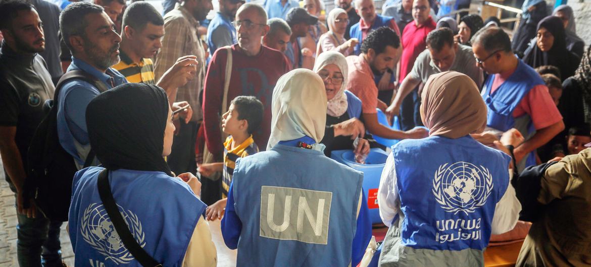 UN staff support a polio vaccination campaign in Gaza.