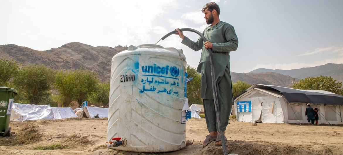 A man fills a tank with fresh water at the Zor Kali Camp in Kunar province, Afghanistan. A man fills a tank with fresh water at the Zor Kali Camp in Kunar province, Afghanistan.