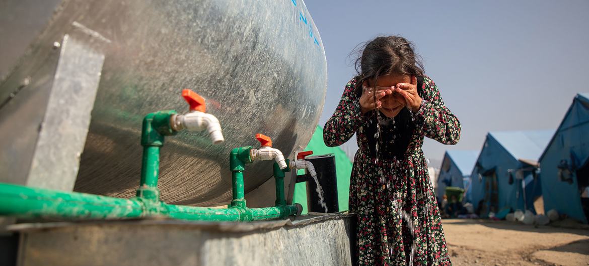 A girl washes her face at a camp for people displaced by the earthquake in Kunar province, Afghanistan. A girl washes her face at a camp for people displaced by the earthquake in Kunar province, Afghanistan.