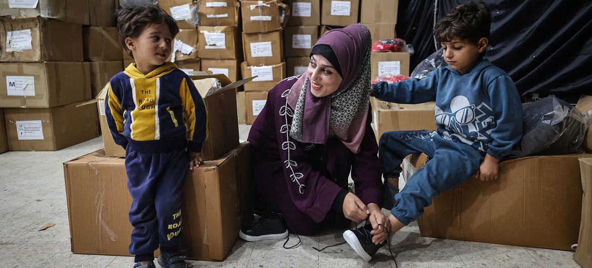 Children in the Gaza Strip receive winter clothing kits from UNICEF.