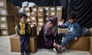 Children in the Gaza Strip receive winter clothing kits from UNICEF.
