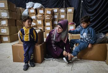 Children in the Gaza Strip receive winter clothing kits from UNICEF.
