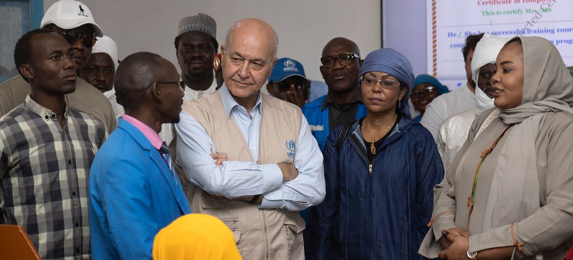 Barham Salih, UN High Commissioner for Refugees, speaks with Sudanese refugees at the Farchana Connected Centre in Chad, supporting education and digital skills for youth.