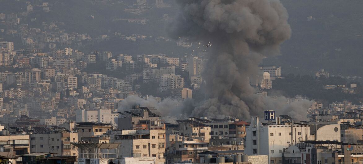 Smoke rises from a building hit by bombing on March 12, 2026, in the Dahieh neighborhood of Beirut, Lebanon.