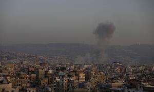 Smoke rises from a building in the Dahieh neighborhood of Beirut, Lebanon, after a bombing on March 12, 2026.