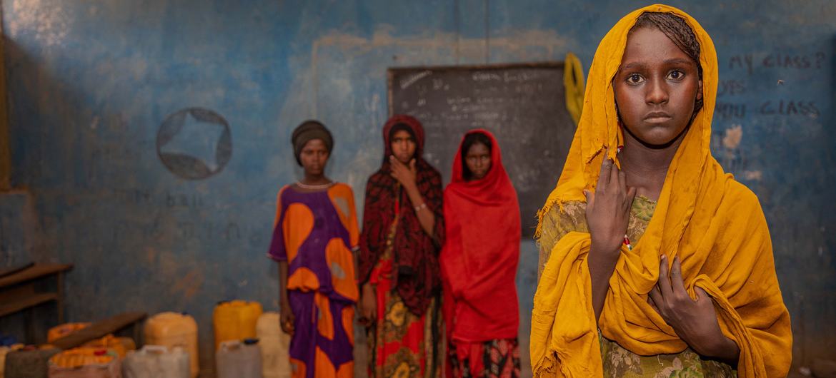 Students stand in their under-equipped classroom in the Afar Region of Ethiopia.