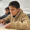 Fourteen-year-old Mohammed, a Palestinian student with visual impairment, concentrates on learning Braille at the Rehabilitation Centre for Visually Impaired Children in Gaza, supported by UNRWA.