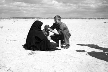 Jelaskovic Ibrahim of the then-Yugoslav medical staff of the UN Emergency Force (UNEF) treats a child in El Kuntilla in the Sinai in Egypt in 1959. (file)