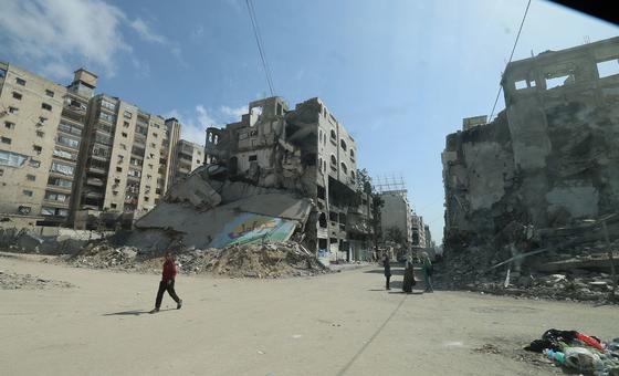 People navigate streets amid rubble and bombed out buildings in Gaza (May, 2025) People navigate streets amid rubble and bombed out buildings in Gaza (May, 2025)
