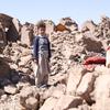 A child stands amidst the ruins left in the aftermath of the devastating October 2023 earthquakes in Herat, Afghanistan.