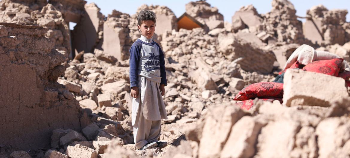 A child stands amidst the ruins left in the aftermath of the devastating October 2023 earthquakes in Herat, Afghanistan.
