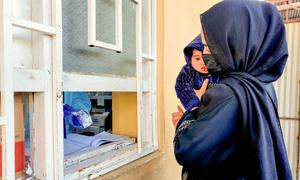 A mother fills a prescription for her child at a hospital in Kabul, Afghanistan. (file photo)