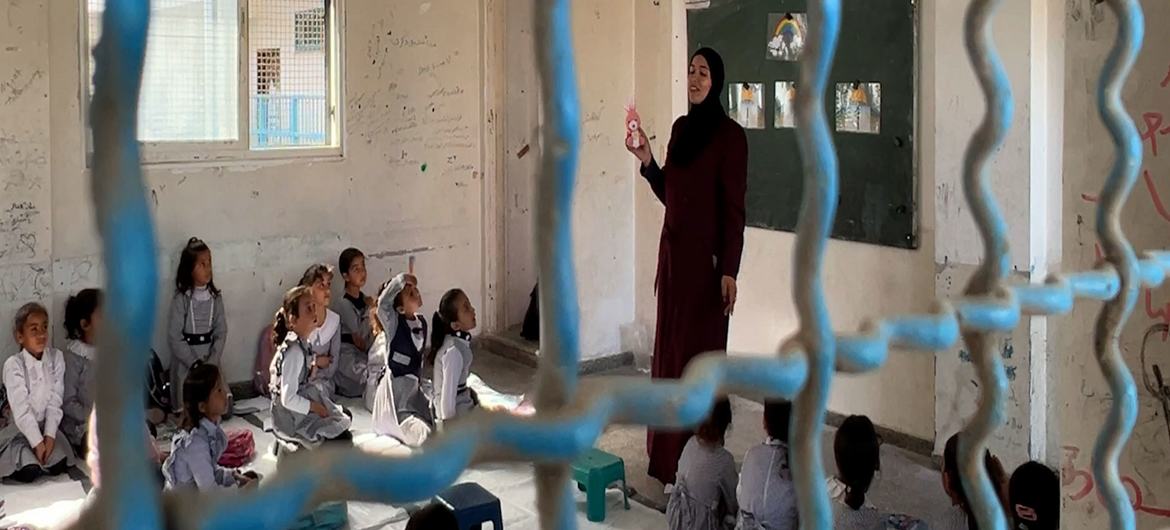 A teacher gives a lesson at an UNRWA-supported school in Gaza.