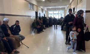 Patients wait to see medics at the UNRWA health centre in Maan, southern Gaza.
