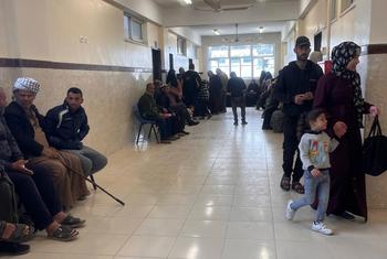 Patients wait to see medics at the UNRWA health centre in Maan, southern Gaza.