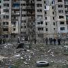Residents assess the damage to buildings in Kupiansk, in the Kharkiv region of Ukraine. (file photo)