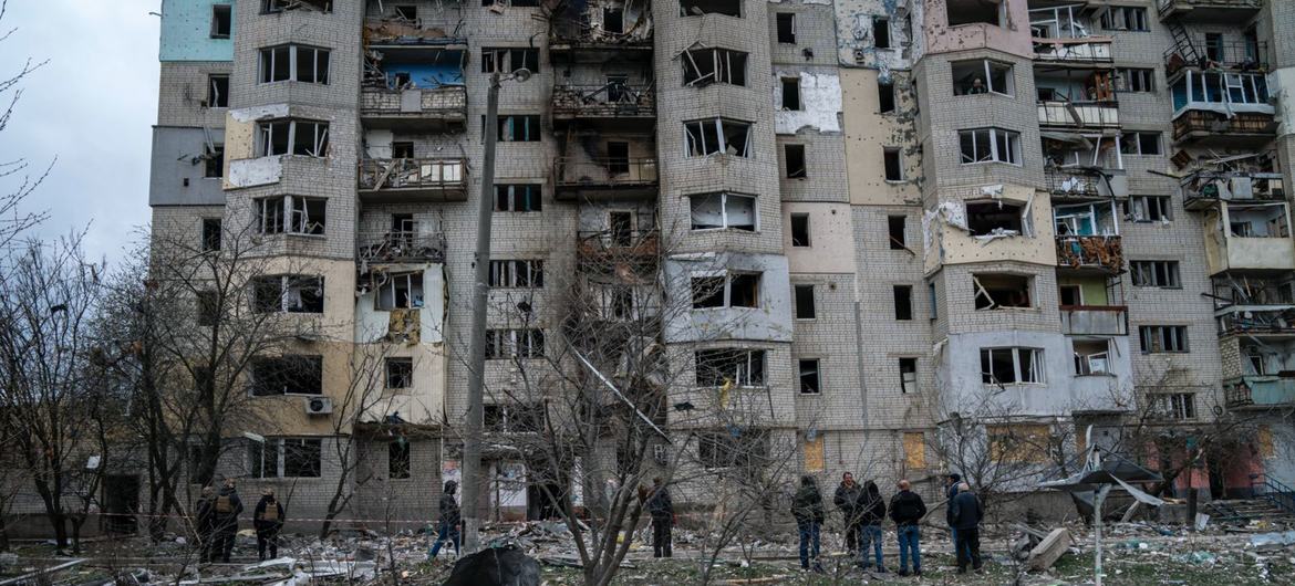 Residents assess the damage to buildings in Kupiansk, in the Kharkiv region of Ukraine. (file photo)