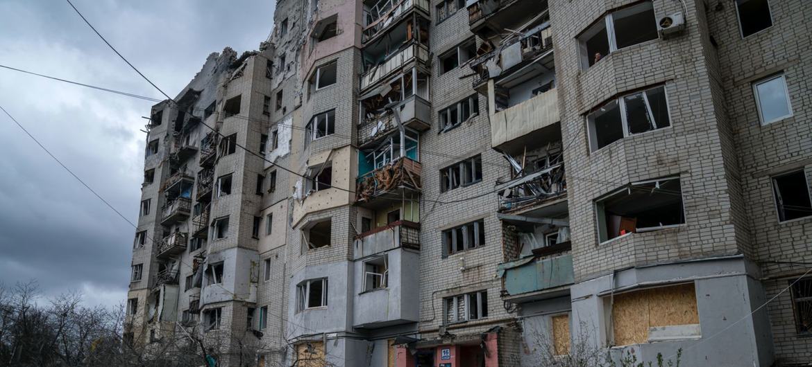 A person walks into a destroyed building in Kupiansk in eastern Ukraine.