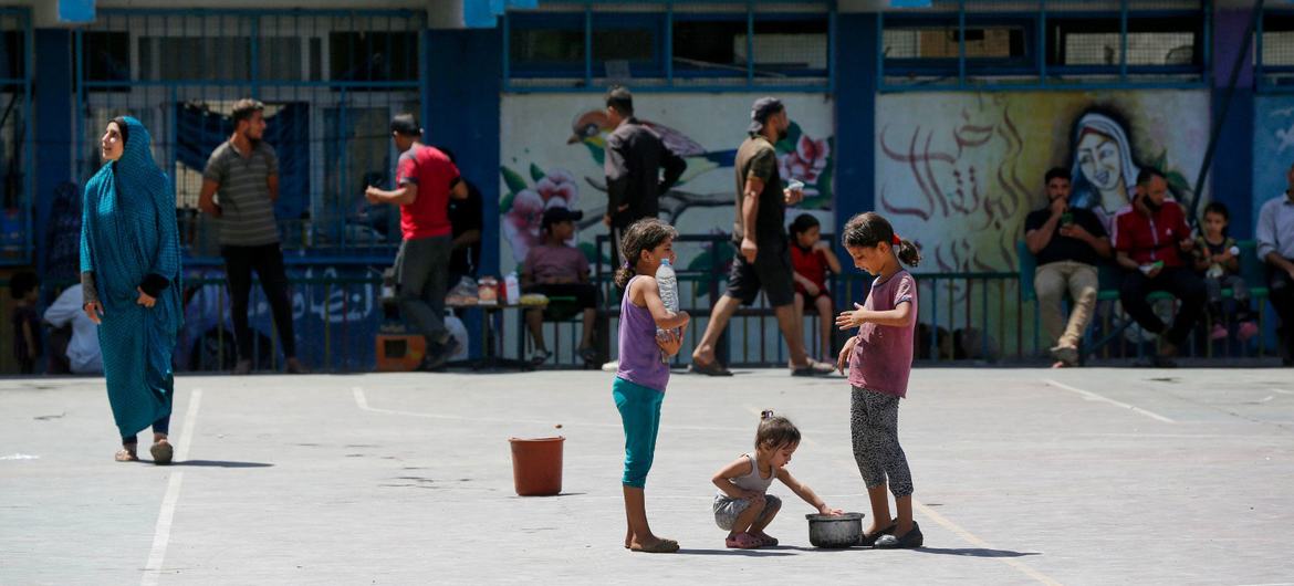 Children in Gaza play in a school converted into a shelter for families displaced by the conflict.