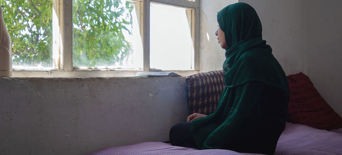 A teenage girl in Afghanistan stays at home as she is no longer allowed to attend school.