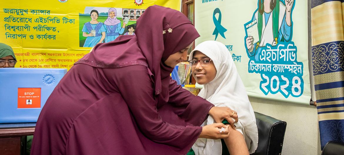 A girl in Mymensingh, Bangladesh, receives an HPV vaccine which can help to prevent cervical cancer.