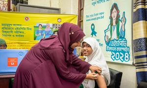 A girl in Mymensingh, Bangladesh, receives an HPV vaccine which can help to prevent cervical cancer.  