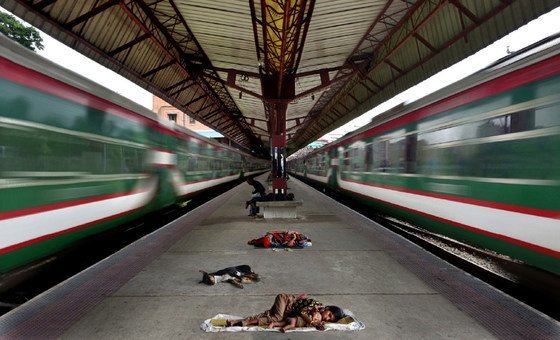 In Bangladesh, people sleep rough in dangerous and unhealthy conditions at a train station in Chittagong. 