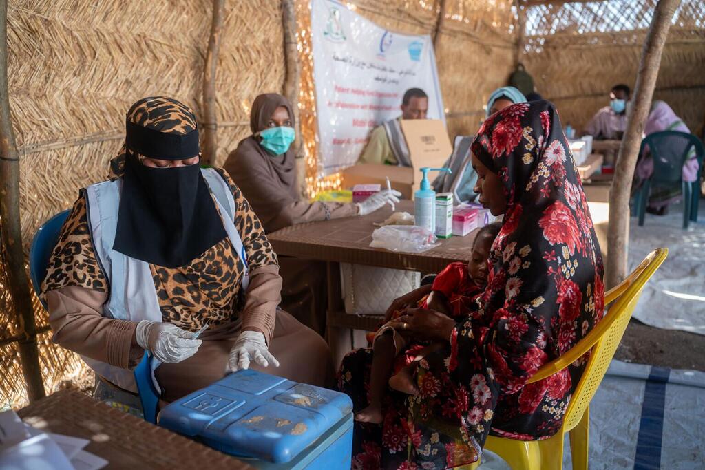 A woman who fled violence in Sudan's Kordofan region receives treatment at a UN-supported clinic.