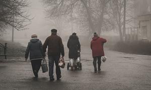 People living in areas recently liberated by Ukrainian forces receive aid.