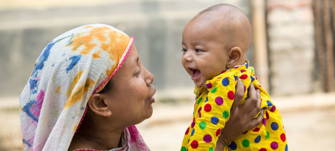 A mother and child attend a nutrition centre in Bangladesh.