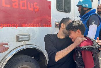 A young boy is treated by a mobile emergency clinic team in Northern Gaza.