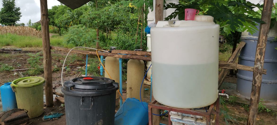 The homemade water filtration system maintained by teachers for clean water use.