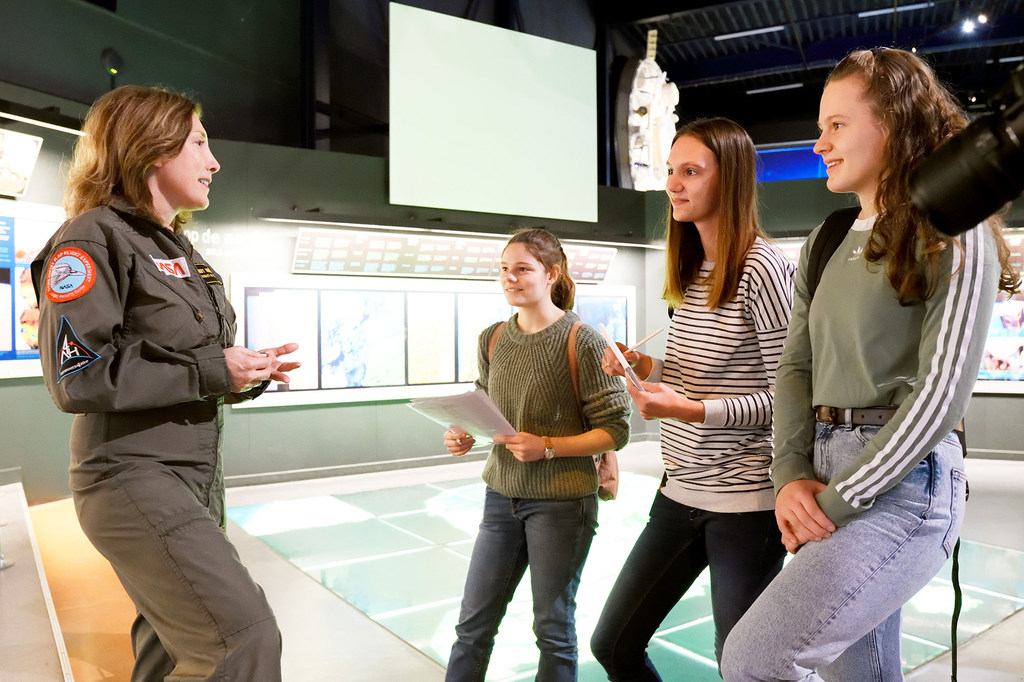 Mindy Howard talks with girls about space. 
