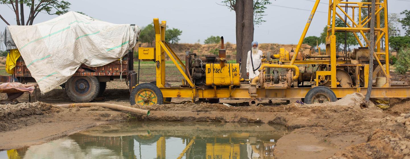 Farmers in Punjab, India are borewell drilling machines to access water.
