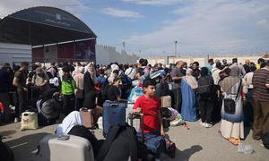 Families gather at the Rafah crossing in the hope of leaving Gaza.