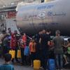 Drinking water is distributed to residents and displaced people in Rafah in the south of the Gaza strip.